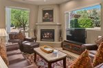 Enjoy a lovely fire and grand views from the living room